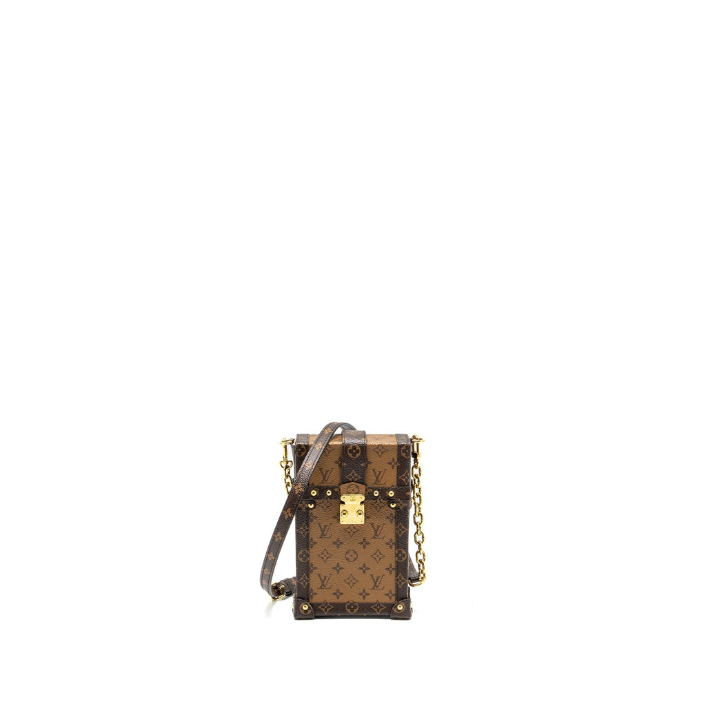 VERTICAL TRUNK POCHETTE WITH CHAIN MONOGRAM REVERSE CANVAS GHW