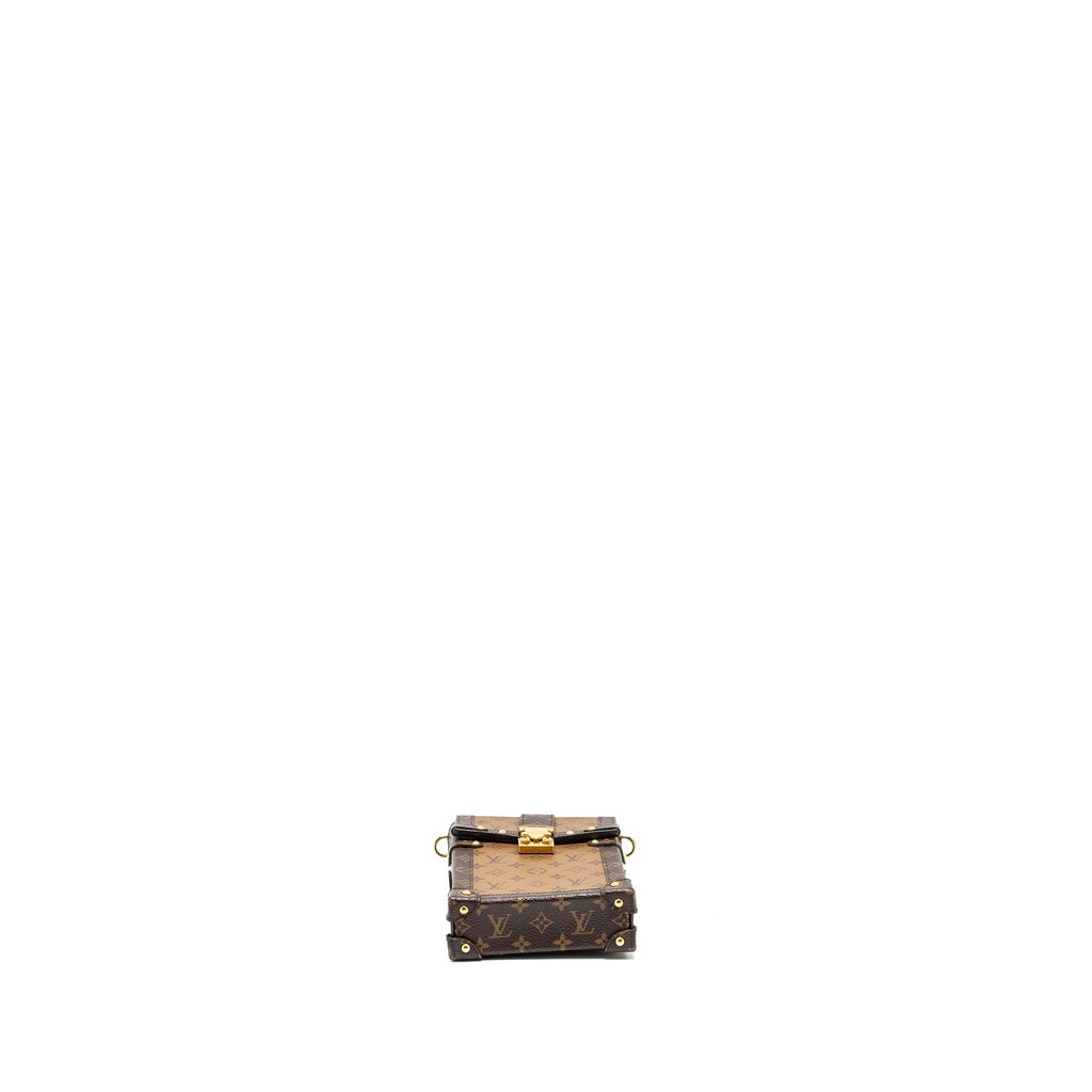 VERTICAL TRUNK POCHETTE WITH CHAIN MONOGRAM REVERSE CANVAS GHW
