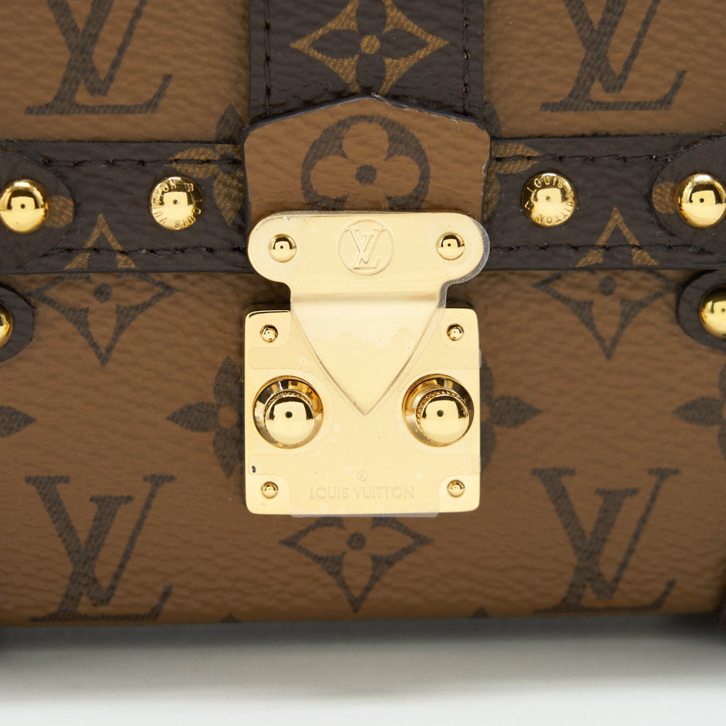 ESSENTIAL TRUNK WITH CHAIN REVERSE MONOGRAM