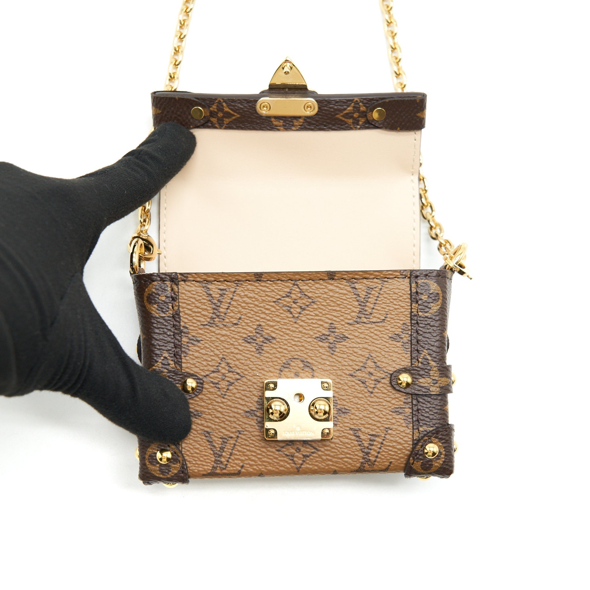 ESSENTIAL TRUNK WITH CHAIN REVERSE MONOGRAM