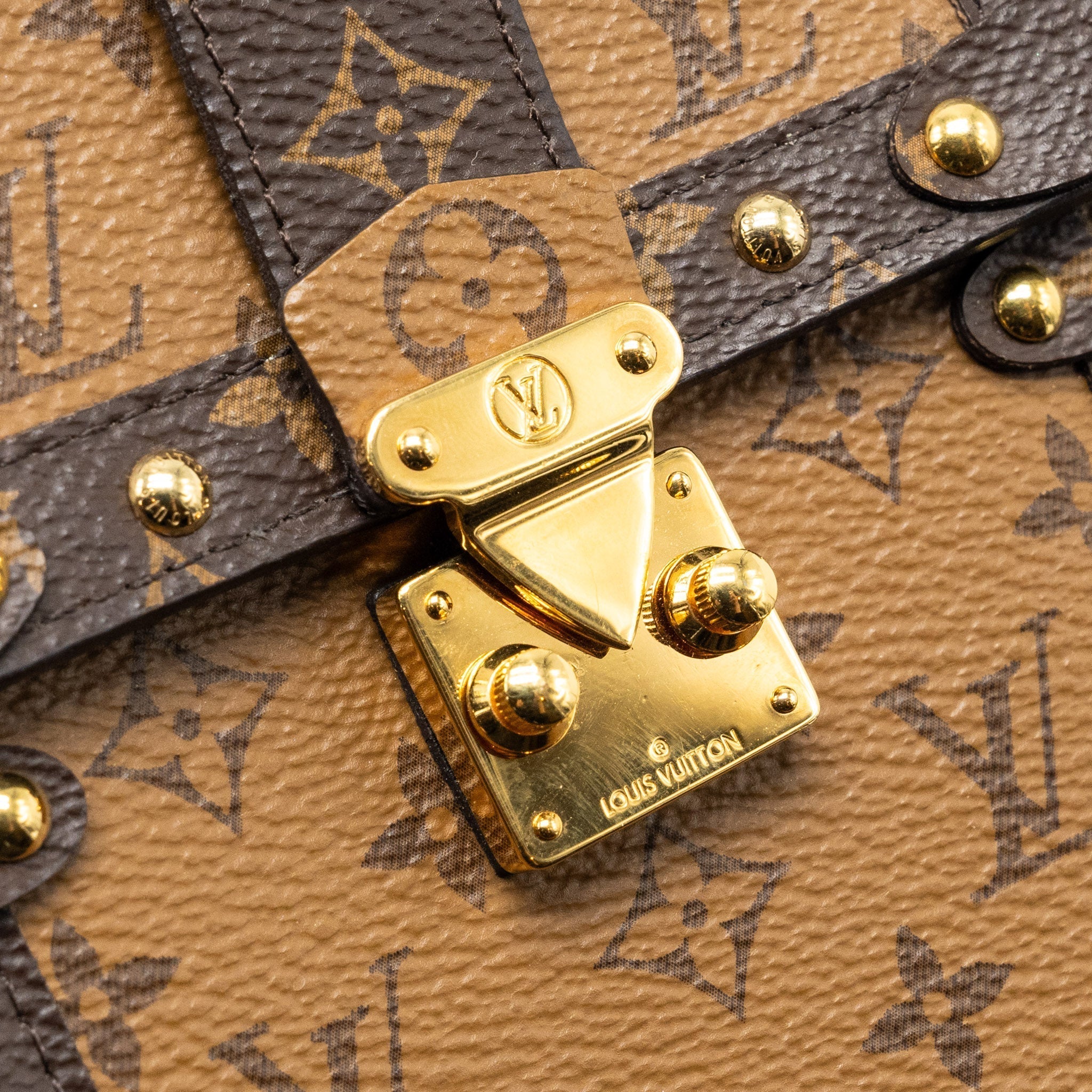 VERTICAL TRUNK POCHETTE WITH CHAIN MONOGRAM REVERSE CANVAS GHW