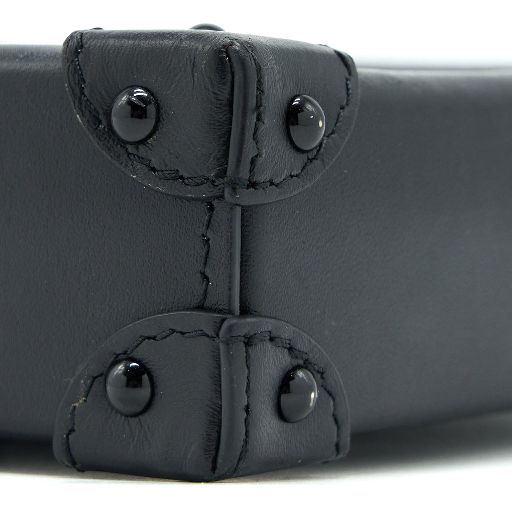 VERTICAL TRUNK POCHETTE MONOGRAM CANVAS GHW