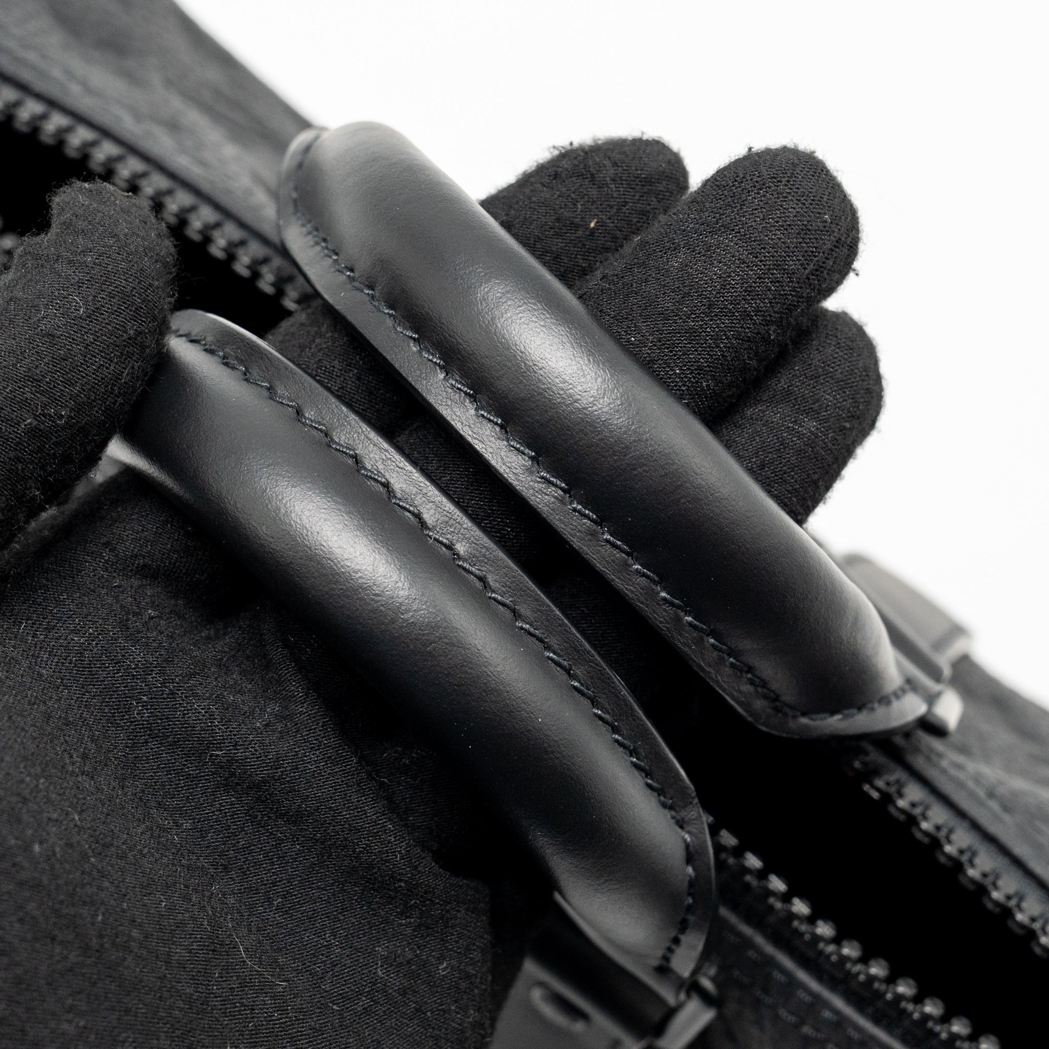 KEEPALL BANDOULIERE 25 MONOGRAM TAURILLON LEATHER BLACK WITH BLACK HARDWARE