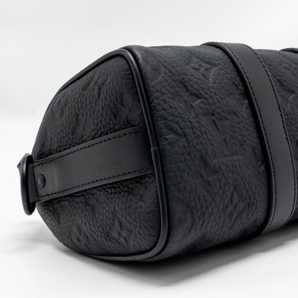 KEEPALL BANDOULIERE 25 MONOGRAM TAURILLON LEATHER BLACK WITH BLACK HARDWARE