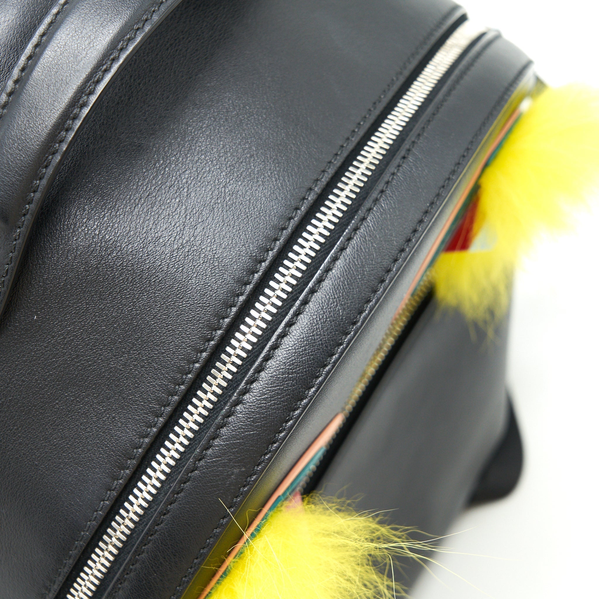 MONSTER BACKPACK IN BLACK WITH YELLOW FUR