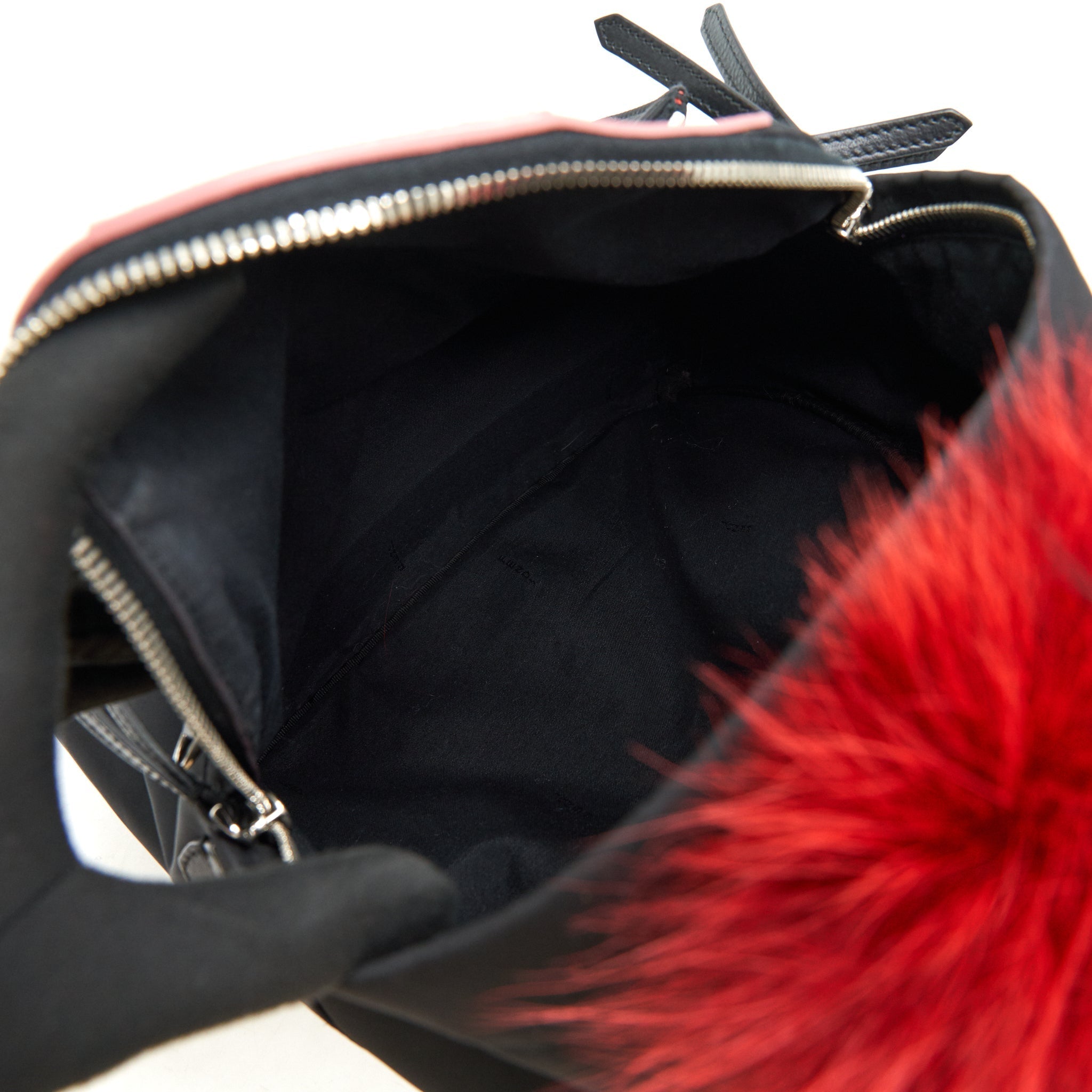 MONSTER BACKPACK IN BLACK WITH RED FUR